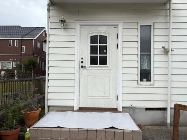ミネトーヨー住器の【八王子市】断熱玄関カバー工事　リシェントⅢの施工前の写真1