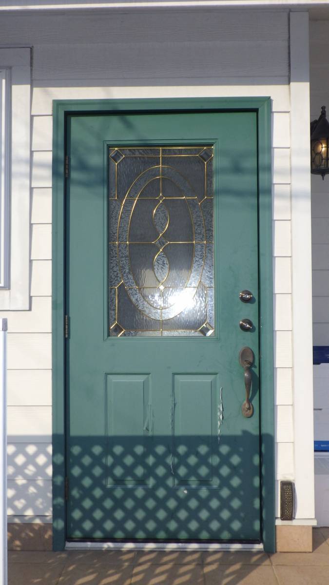 北摂トーヨー住器の玄関ドア取替工事の施工前の写真1
